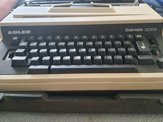 Adler electric typewriter in case