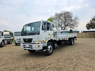 2012 Nissan UD90 Dropside truck for sale. Truck is in excellent condition