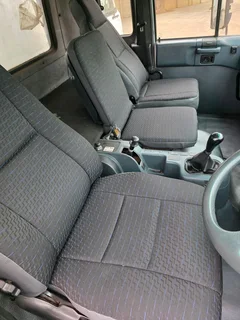 2012 Nissan UD90 Dropside truck for sale. Truck is in excellent condition