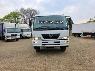 2012 Nissan UD90 Dropside truck for sale. Truck is in excellent condition