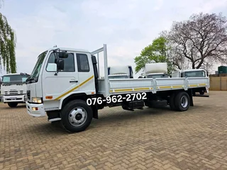 2012 Nissan UD90 Dropside truck for sale. Truck is in excellent condition