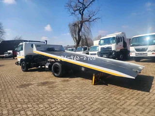 2010 Nissan UD40L Rollback with Hydraulic winch for sale