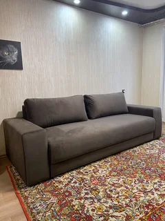 The Home Stores' Three Seater Lounge Sofa In Dark Grey Velvet With Back Rest Cushioning