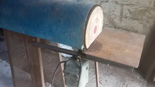 Three phase  disk sander which can accept wire brushes or polishing mops to opposite end good condit