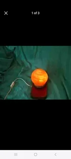 Moon Himalayan Salt Lamp on varnished hardwood base