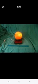Moon Himalayan Salt Lamp on varnished hardwood base