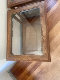 Two antique wood and glass side tables for sale