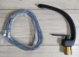 New Mixer for Basin, new in original box. Table View.