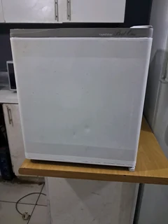 Small bar fridge for sale.