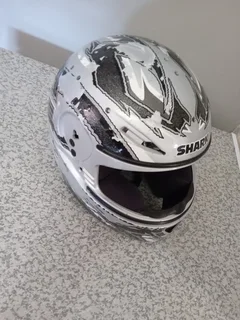 SHARK HELMET . PAINT IS PEELING  OF AND STRAP IS FAULTY R75