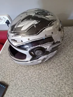 SHARK HELMET . PAINT IS PEELING  OF AND STRAP IS FAULTY R75