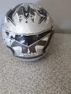 SHARK HELMET . PAINT IS PEELING  OF AND STRAP IS FAULTY R75