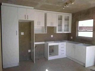 Kitchen Cabinets,TV stands and Decking,Tilling and more