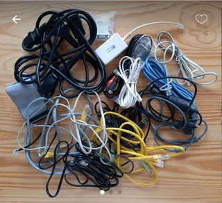 Assorted Television, computer and phone cables and attachments.