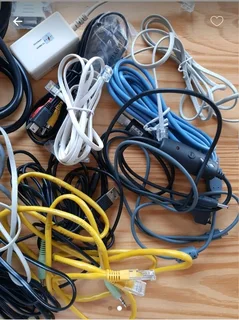 Assorted Television, computer and phone cables and attachments.