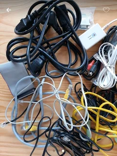 Assorted Television, computer and phone cables and attachments.