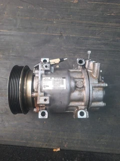 Nissan np200 aircon pump