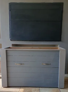 Wooden storage box fitted with wheels