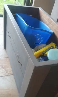 Wooden storage box fitted with wheels