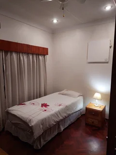 Furnished room to rent for employed singles in 5 bedroom house; can work online; services included.