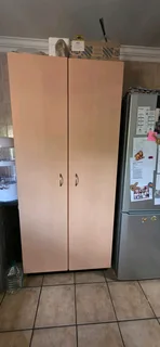 Kitchen cupboards, extractor fan, tap, double sink.