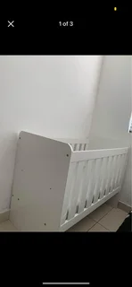 White wooden baby cot
