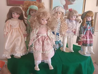 A collection of 6 beautiful porcelain dolls