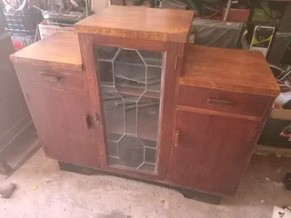 Antique teak display cabinet with lead glass door