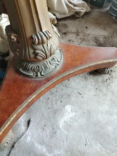 Pedestal base round antique table.