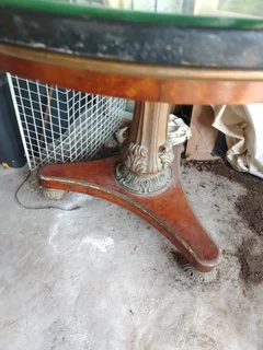 Pedestal base round antique table.