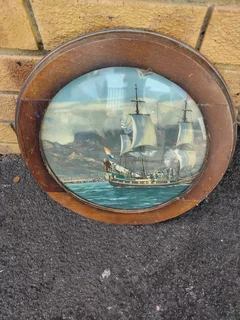 Round painting in wooden frame