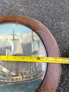 Round painting in wooden frame