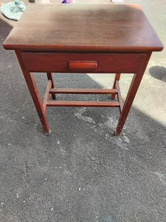 Wooden table with drawer