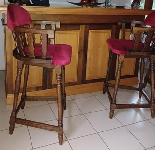 Imbuia and yellowwood L-shape home bar with upholstered chairs