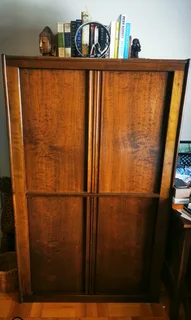 Wood Cabinet/storage with sliding doors.