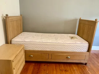 Custom oak single bed and Weylandts bedside table