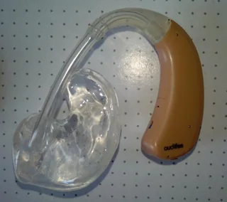 Hearing Aid AudiFon with Charging Station and new battery. All in perfect working Condition.