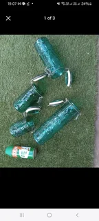 Four (4) Green coloured decorative Mason style jarsIn very good condition with no damage