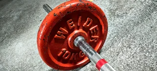 Stainless steel barbell and 2 x 10kg Weider Weight Discs