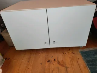 Hanging closet and additional cuboard for on top