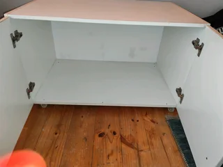 Hanging closet and additional cuboard for on top