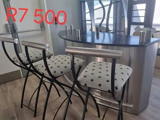 Bar with 4 chairs and wine rack