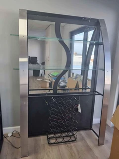 Bar with 4 chairs and wine rack