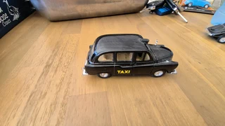 WELLY THE LONDON TAXI TX4 BLACK 1:34 DIE CAST METAL MODEL.