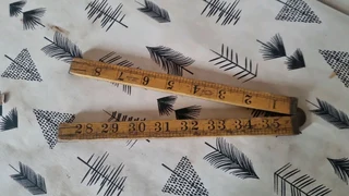 Vintage collectors ruler with brass hinges.