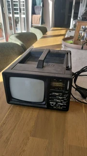 Vintage silver portable radio tv for sale in working order.