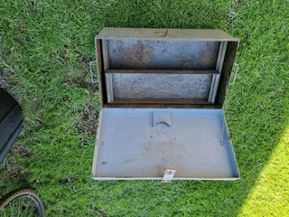 Nice solid metal toolbox with racks up for grabs