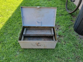 Nice solid metal toolbox with racks up for grabs