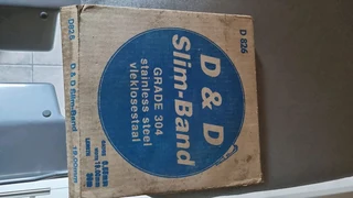 SS 304 s t r a p p i n g 12 7mm w i d e x0 75mm t h i c k 30 m r o l l.