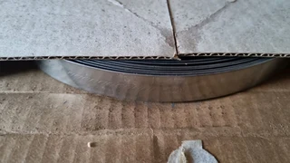 SS 304 s t r a p p i n g 12 7mm w i d e x0 75mm t h i c k 30 m r o l l.